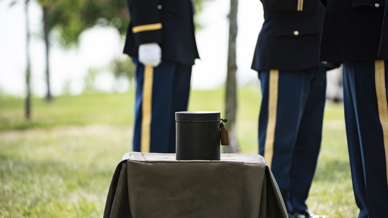 An urn containing the remains of Maj. Isaac C. Hart await burial during the service Thursday.