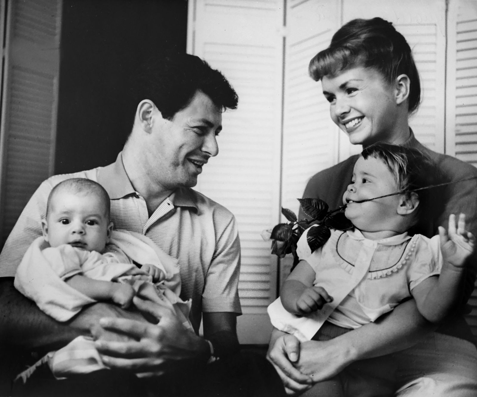 Fisher, bottom right, is photographed with her parents and her brother, Todd, who was born in 1958.