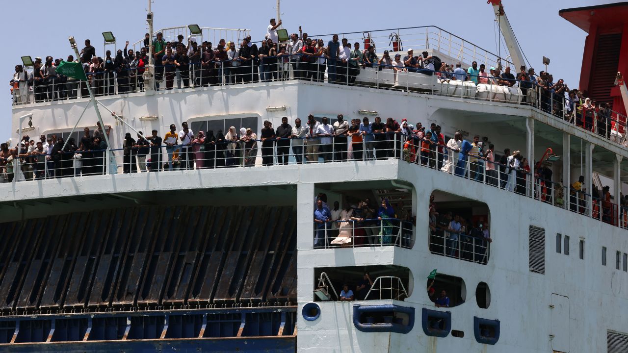 Evacuees stand on a ferry as it transports some people across the Red Sea from Port Sudan to the Saudi King Faisal navy base in Jeddah, on April 29, 2023, during mass evacuations from Sudan. 