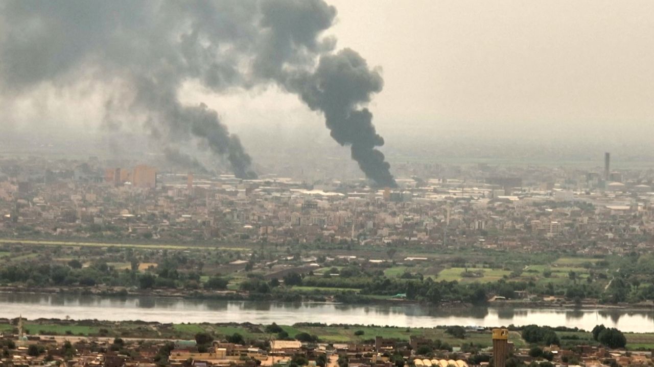 This image grab taken from AFPTV video footage on April 28, 2023, shows an aerial view of black smoke rising over Khartoum, Sudan. 