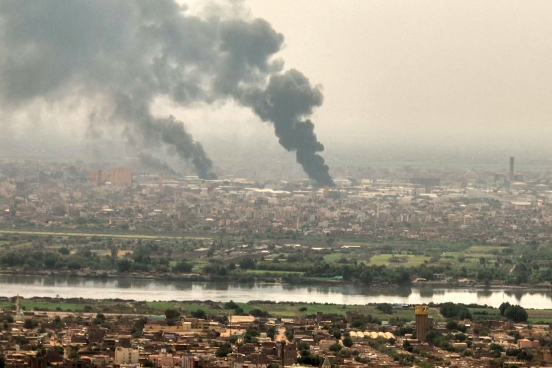 An aerial view of black smoke rising over Khartoum.