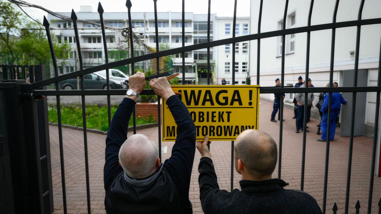 City officials put up a warning sign on the gate of a Russian embassy in Warsaw, Poland on April 29.