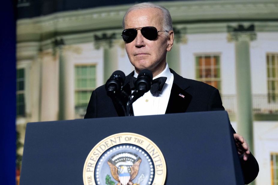 President Joe Biden speaks while wearing sunglasses at the correspondents' dinner in 2023.