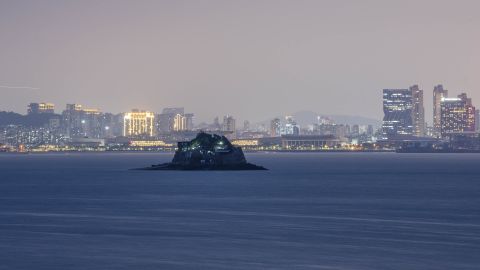 Views of Xiamen, a major Chinese coastal city, from the Taiwan-controlled Kinmen islands at dusk. The middle island, Shiyu, is also controlled by Taiwanese troops.