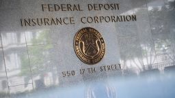 A general view of the Federal Deposit Insurance Corporation (FDIC) logo on its headquarters in Washington, D.C., on May 2, 2020 amid the Coronavirus pandemic. Earlier today, thousands of visitors flocked to the Mall and other scenic sites around the Capital area to see a flyover by Navy Blue Angels and Air Force Thunderbirds in honor of medical personnel and first responders, meanwhile the global confirmed COVID-19 death toll approached 250,000.