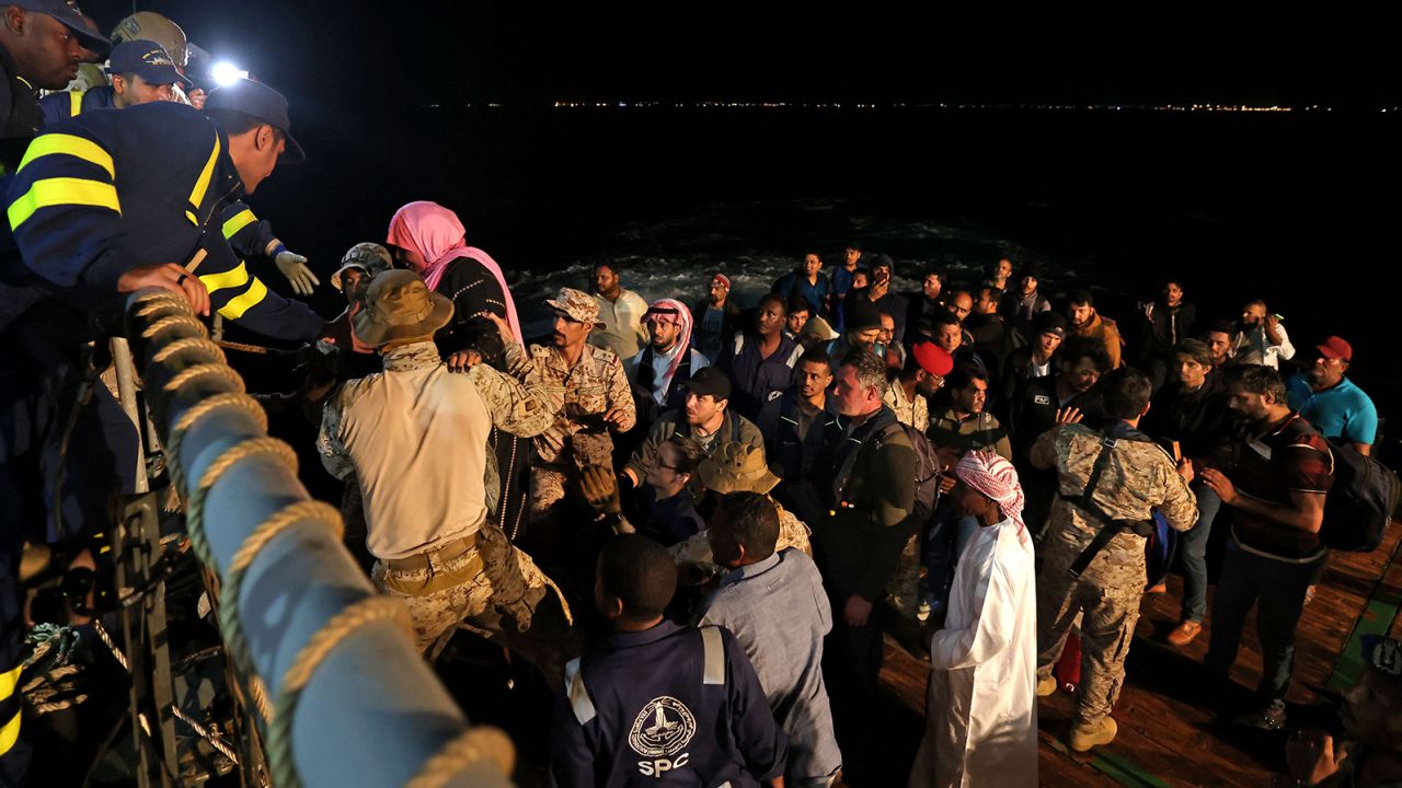 Saudi naval and special forces hoist evacuees aboard a vessel headed from Port Sudan to Jeddah, Saudi Arabia, on April 30. The port city has become a hub for refugees trying to escape the violence.