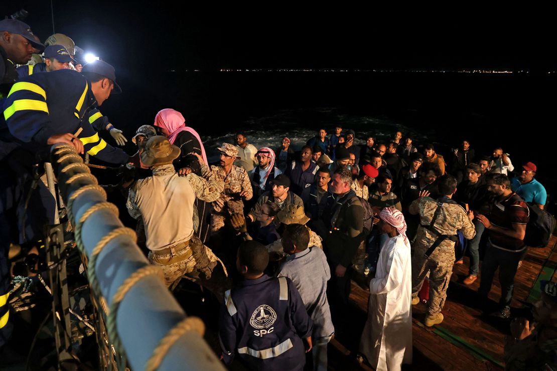 Saudi forces hoist evacuees aboard a vessel during a rescue operation from Port Sudan to Jeddah, on April 30, 2023.