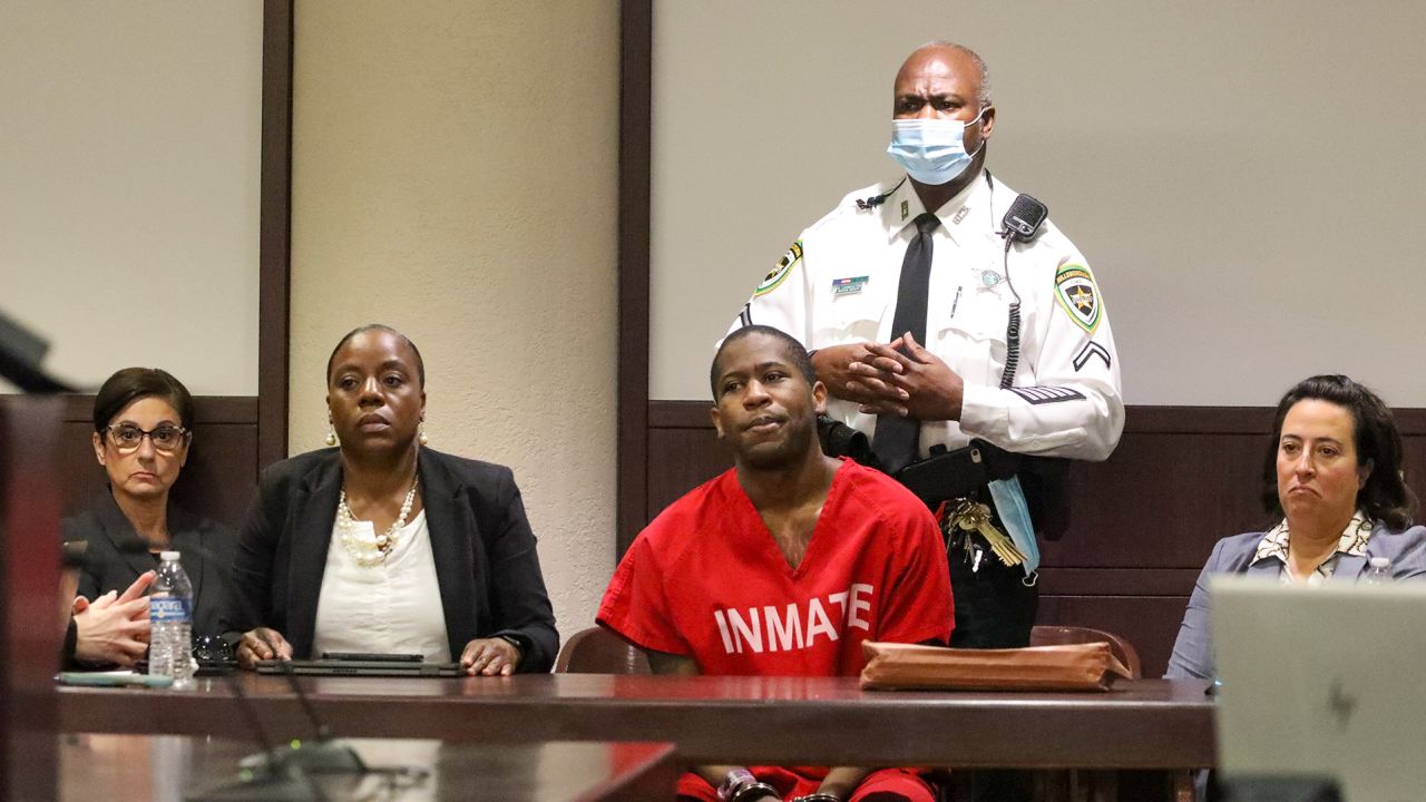 Howell Emanuel Donaldson III listens as the family of his murder victims speaks during his plea hearing in Florida Circuit Court on Monday, May 1 in Tampa.