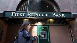 SAN FRANCISCO, CALIFORNIA - MARCH 16: A pedestrian walks by a First Republic Bank office on March 16, 2023 in San Francisco, California. A week after Silicon Valley Bank and Signature Bank failed, First Republic Bank is considering a sale following a dramatic 60 percent drop in its stock price over the past week. The bank also received $70 billion in emergency loans from JP Morgan Chase and the Federal Reserve. 
