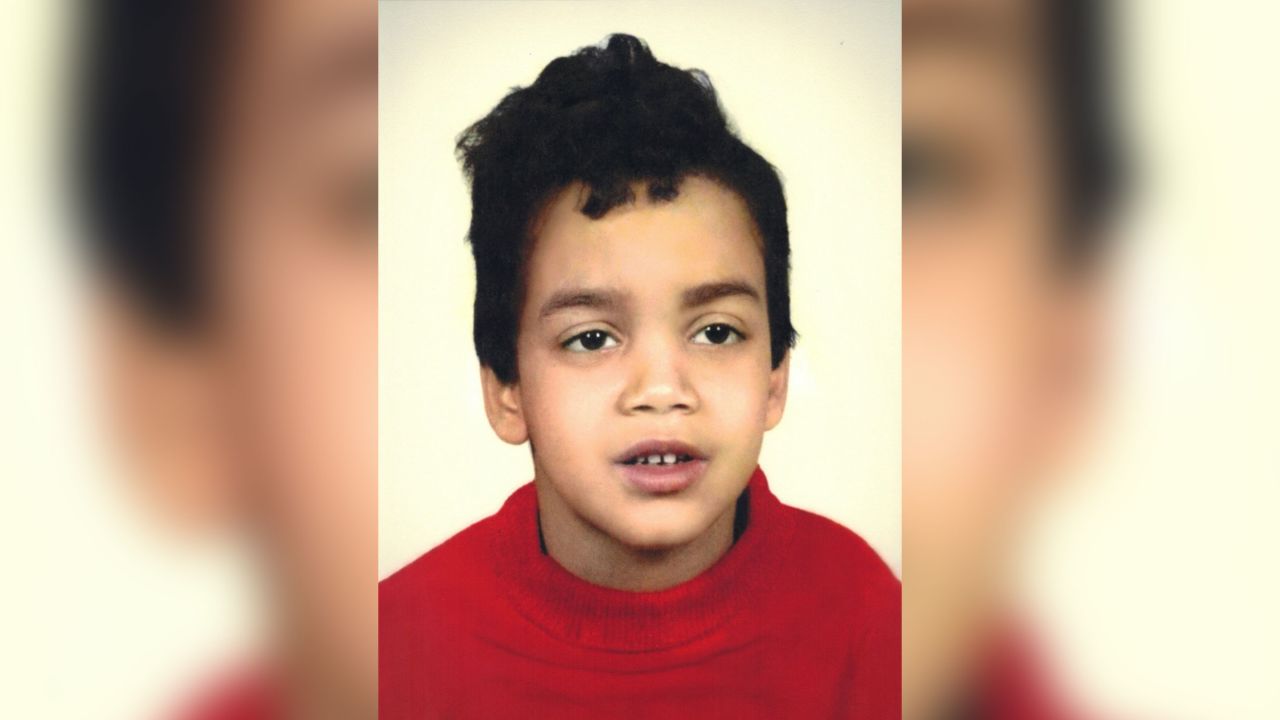 John Blake, seen here in a second-grade photo, grew up as the son of a White mother and Black father. He didn't meet his mother or his White relatives until he was an adult.