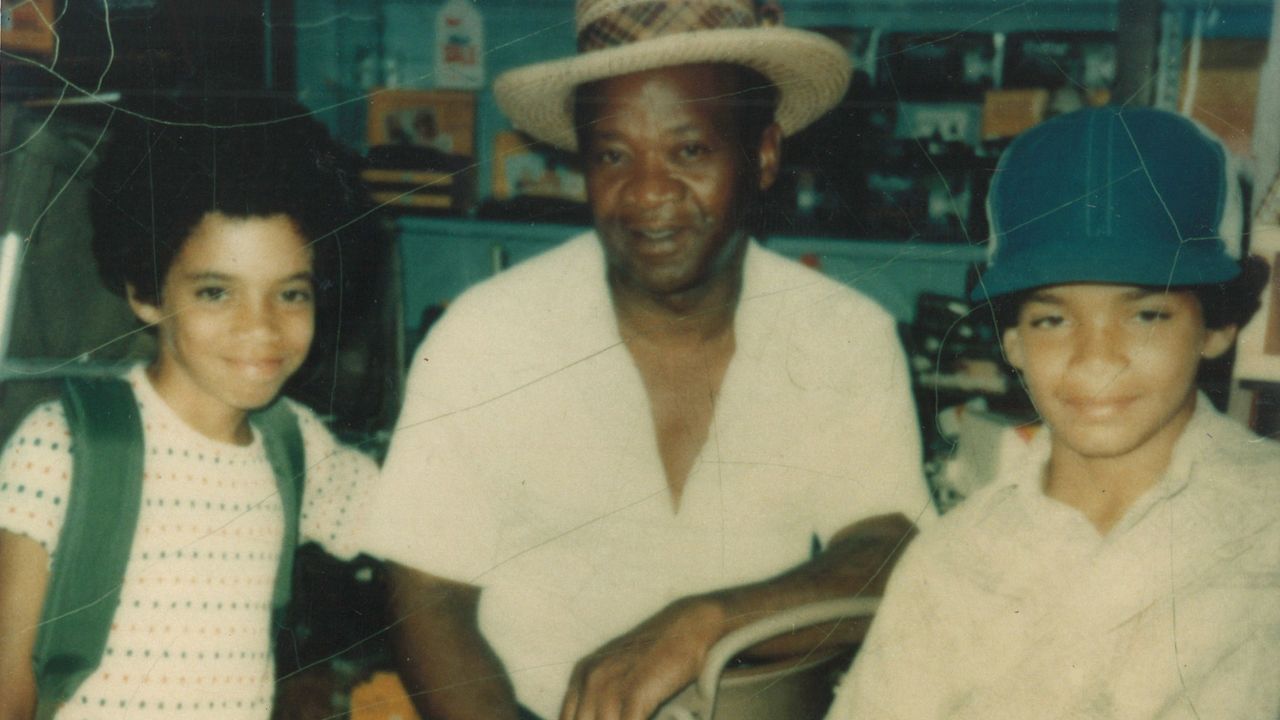 John Blake, right, with his younger brother Patrick and their father, Clifton Avon Blake Sr. Their father faced threats and physical assaults for dating his sons' White mother at a time when interracial marriage was illegal in much of the US.