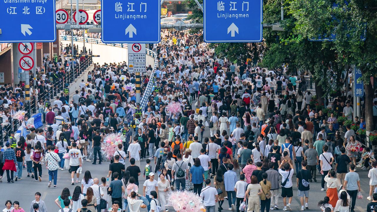 Tourists beseige the Qiansimen Bridge in Chongqing, a city in southwest China.