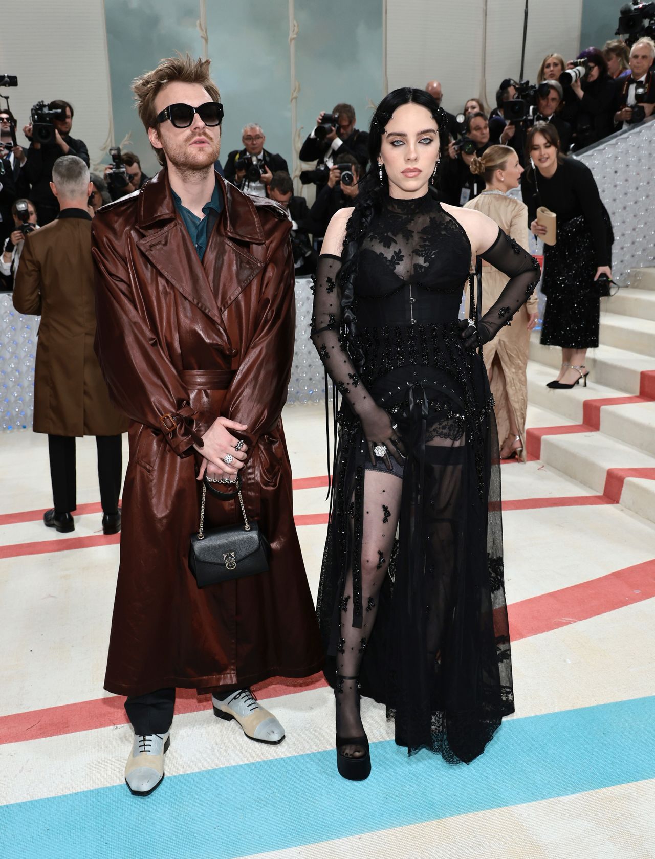 Billie Eilish honored Lagerfeld in a black Simone Rocha ensemble, arriving with brother Finneas dressed in Vivienne Westwood.

