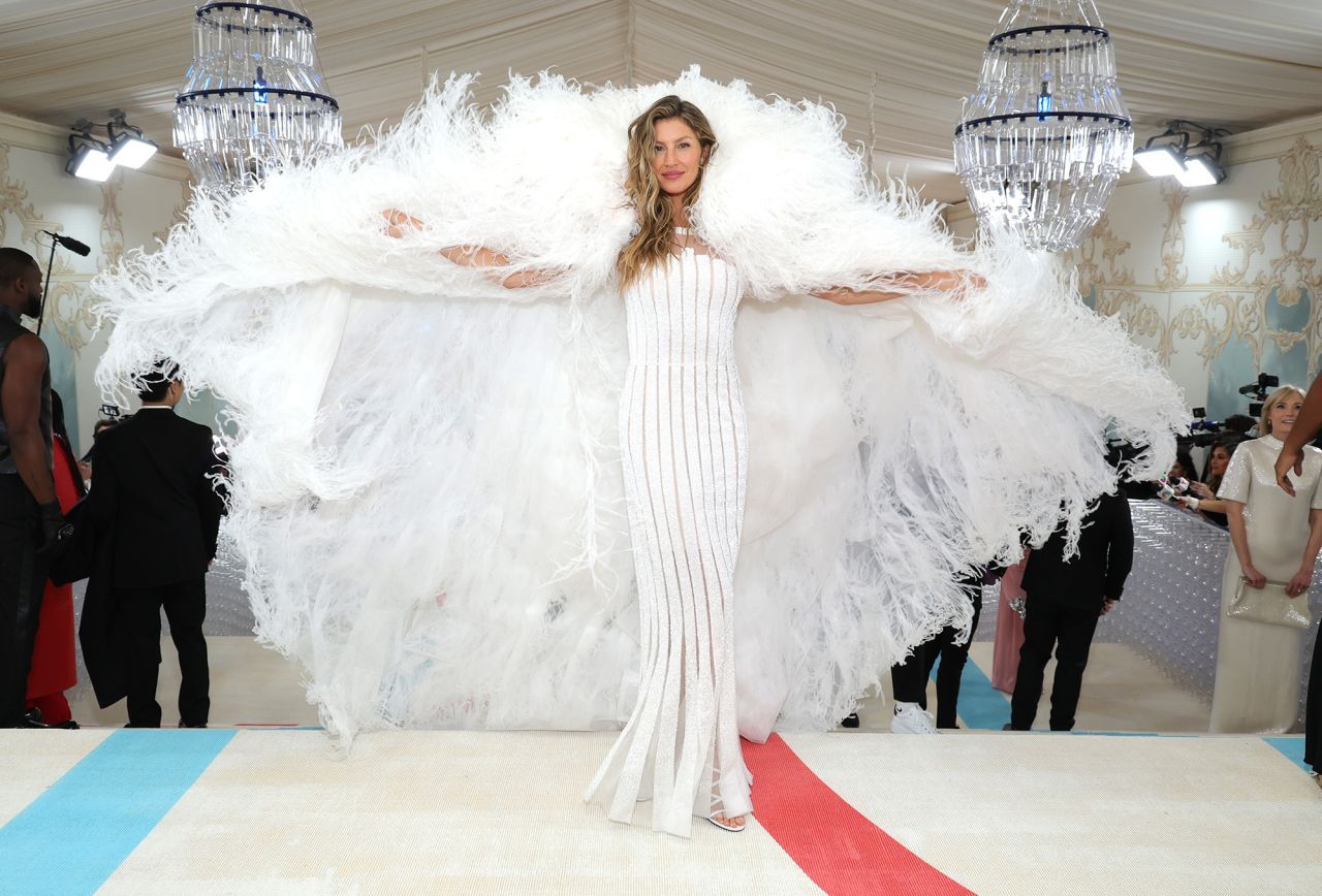 Gisele Bündchen showed up in a feathered cape and vintage Chanel gown, which she previously wore for an editorial shoot with Karl Lagerfeld.
