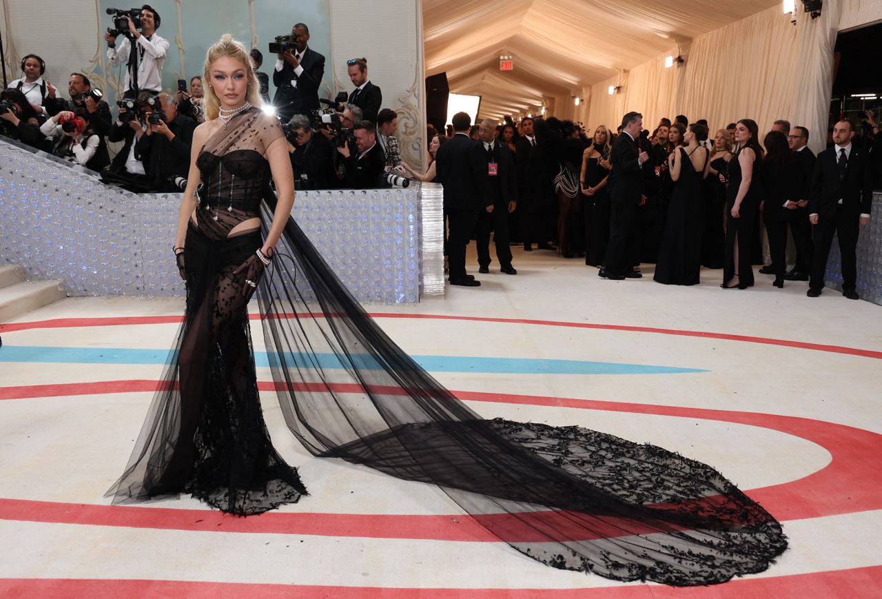 Gigi Hadid arrived draped in a sultry, sheer and corseted Givenchy gown.