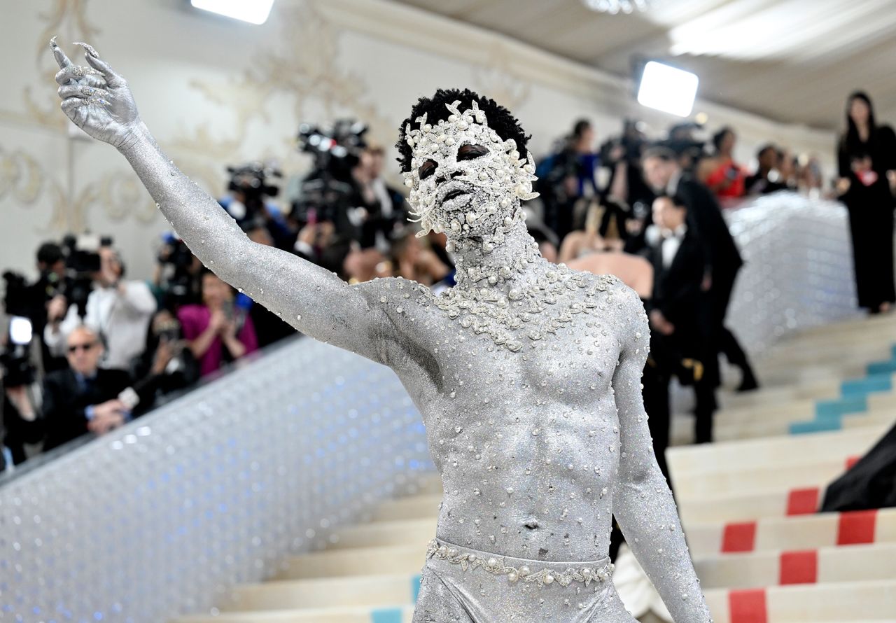 Lil Nas X wore pearls, gems and silver body paint with a look that had little fabric but was meticulously executed by makeup artist Pat McGrath.