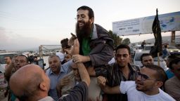 FILE - Palestinian Khader Adnan, center, is greeted by Palestinians after his release from an Israeli prison in the West Bank village of Arrabeh near Jenin, Sunday, July 12, 2015. Palestinian prisoner Adnan died in Israeli custody early Tuesday, May 2, 2023, after a hunger strike of nearly three months, Israel's prison service announced. (AP Photo/Majdi Mohammed, File)