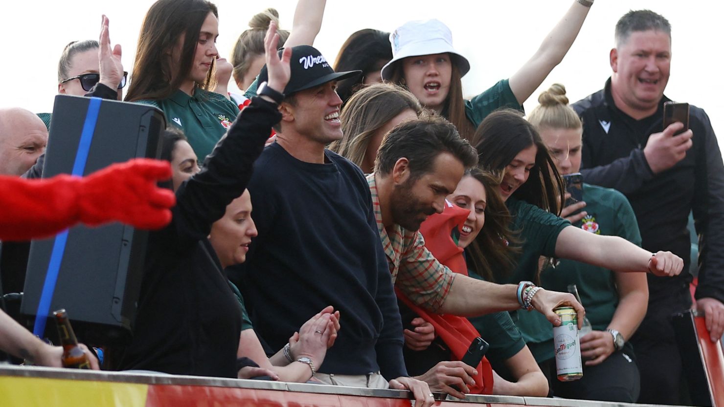 Wrexham co-owners Rob McElhenney and Ryan Reynolds celebrate during the victory parade.