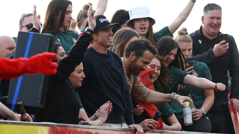 NextImg:Ryan Reynolds and Rob McElhenney join Wrexham's open-top bus parade | CNN