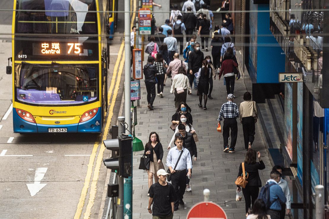 Pedestrians along a road in Hong Kong on April 24, 2023. 