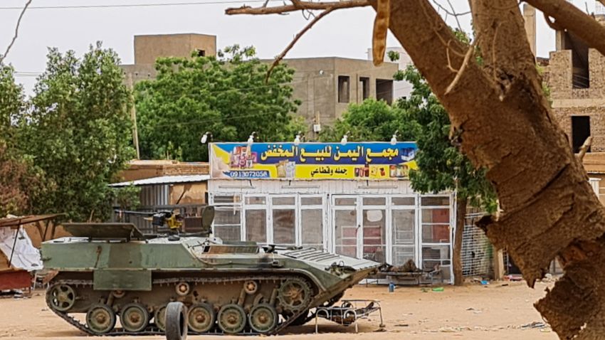 Sudanese Army soldiers rest near a tank at a checkpoint in Khartoum on April 30, 2023, as clashes continue in war-torn Sudan. - Heavy fighting again rocked Sudan's capital on April 30, as tens of thousands have fled the bloody turmoil and a former prime minister warned of the "nightmare" risk of a descent into full-scale civil war. (Photo by AFP) (Photo by -/AFP via Getty Images)
