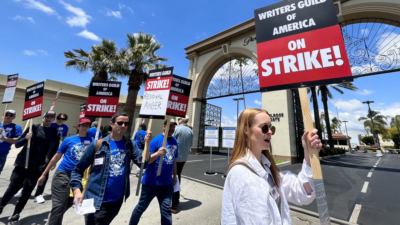 Los Angeles, CA - May 02: WGA members take a selfie before heading to the picket line on the first day of their strike in front of Paramount Studios in Hollywood on May 2, 2023. The union were unable to reach a last minute-accord with the major studios on a new three-year contract to replace one that expired Monday night.