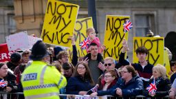 Protestors wait for the arrival of King Charles III and Camilla, the Queen Consort to visit Liverpool Central Library, and to officially mark the Library's twinning with Ukraine's first public Library, the Regional Scientific Library in Odesa, on April 26 in Liverpool, England.