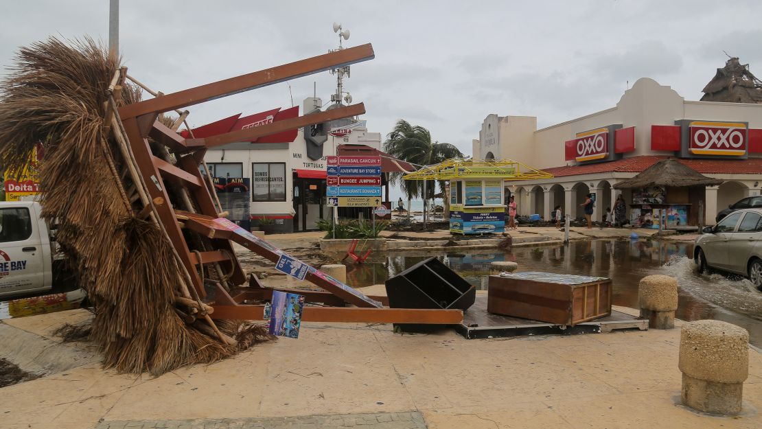 An information kiosk lies on the ground in October 2020 after Hurricane Delta's winds knocked it over in Cancun, Mexico.