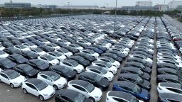 Aerial view of Tesla electric vehicles to be shipped aboard sitting parked at Nangang Port on March 30, 2023 in Shanghai, China. 