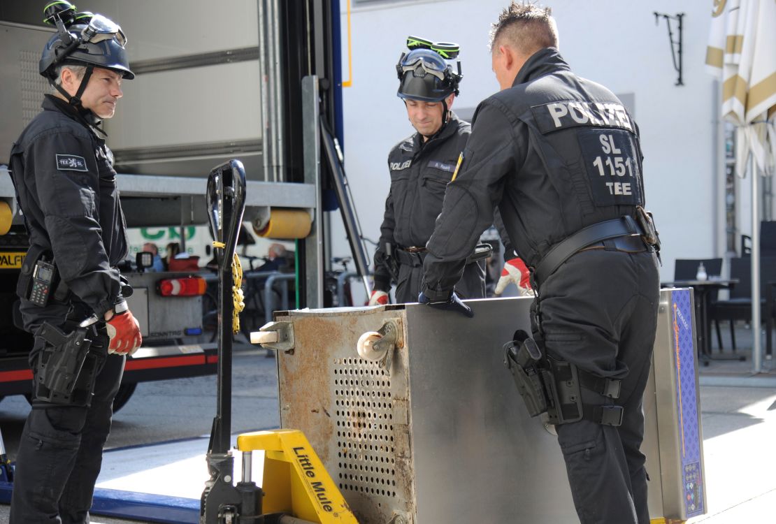 Police officers secure evidence on Wednesday in the town of Saarland in southwestern Germany, as part of the largest ever coordinated raid targeting Italian organized crime.