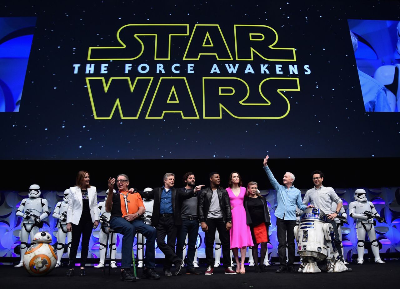 Fisher, in the red skirt, takes part in a "Star Wars" celebration event in April 2015.