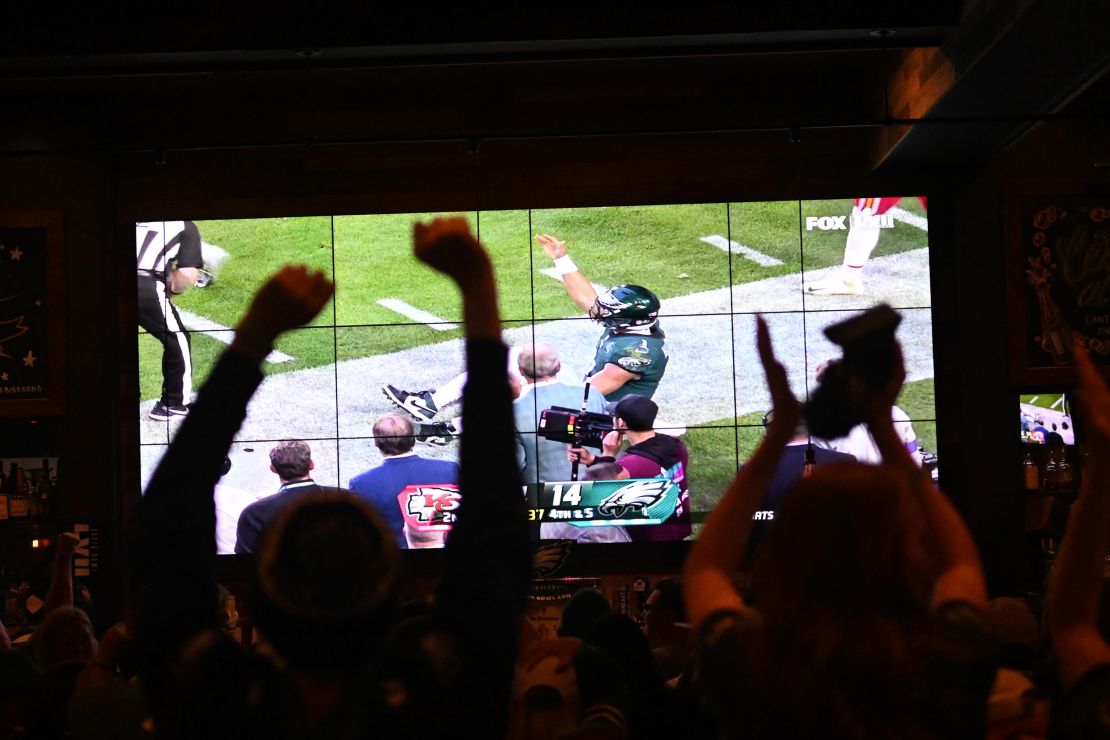 Eagles fans react while watching Super Bowl LVII at City Tap House in Philadelphia.