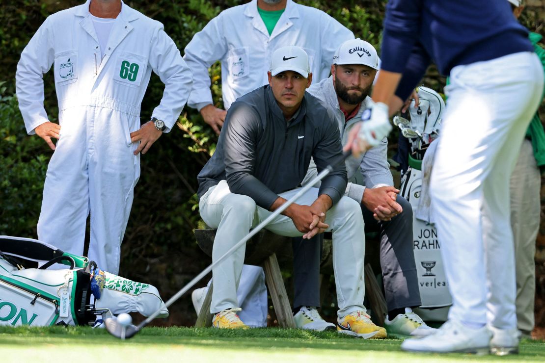 Golf - The Masters - Augusta National Golf Club - Augusta, Georgia, U.S. - April 9, 2023
Spain's Jon Rahm and Brooks Koepka of the U.S. wait by the 2nd tee during the final round REUTERS/Mike Blake