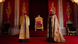 LONDON, ENGLAND - MAY 01:   The Coronation Vestments, comprising of the Supertunica (left) and the Imperial Mantle (right), displayed in the Throne Room at Buckingham Palace on May 1, 2023 in London, England. The vestments will be worn by King Charles III during his coronation at Westminster Abbey on May 6. (Photo by Victoria Jones-Pool/Getty Images)