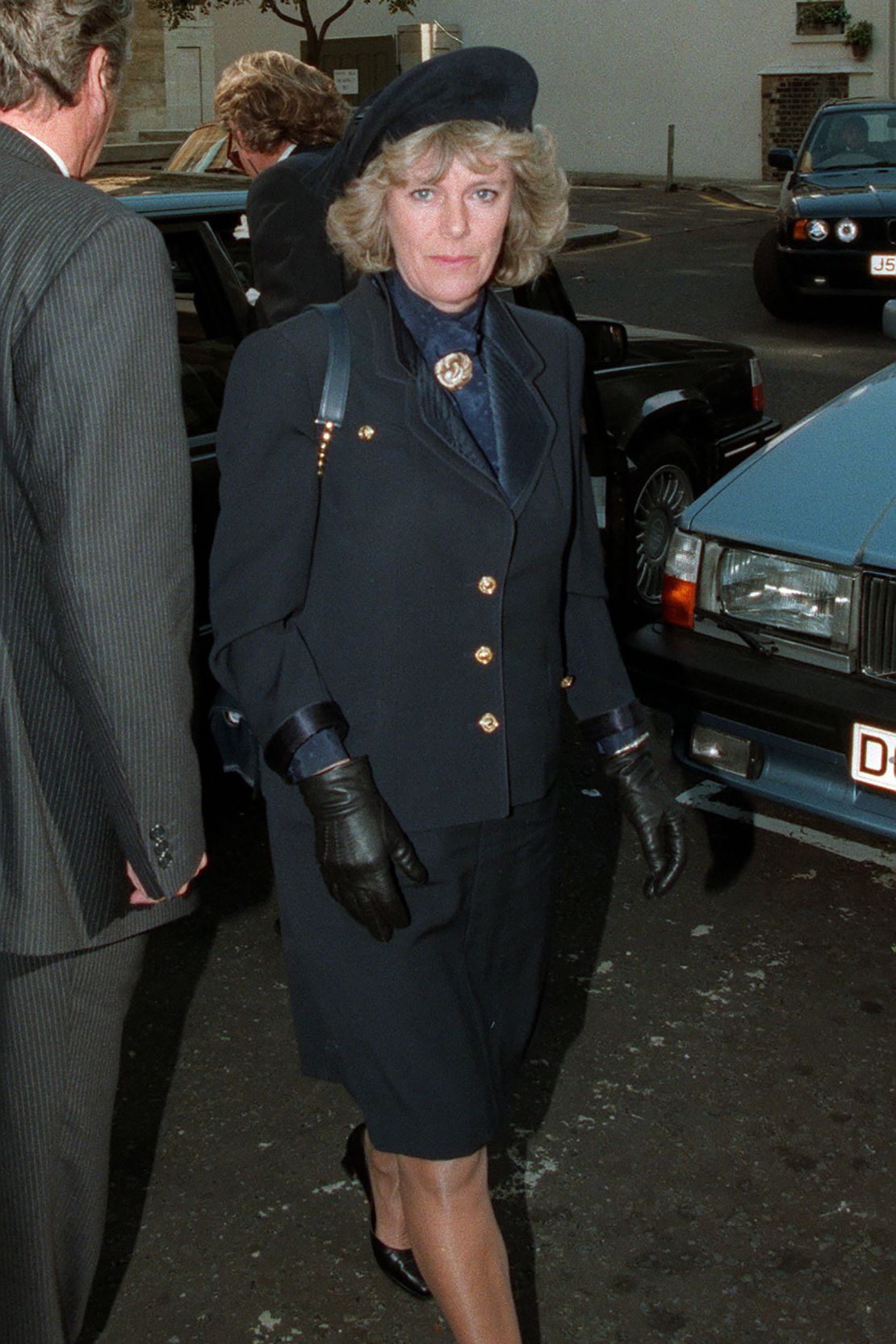 For her mother's funeral on June 6 1994, Camilla wore an elegant black skirt suit with gold detailing, a navy shirt and a black beret.