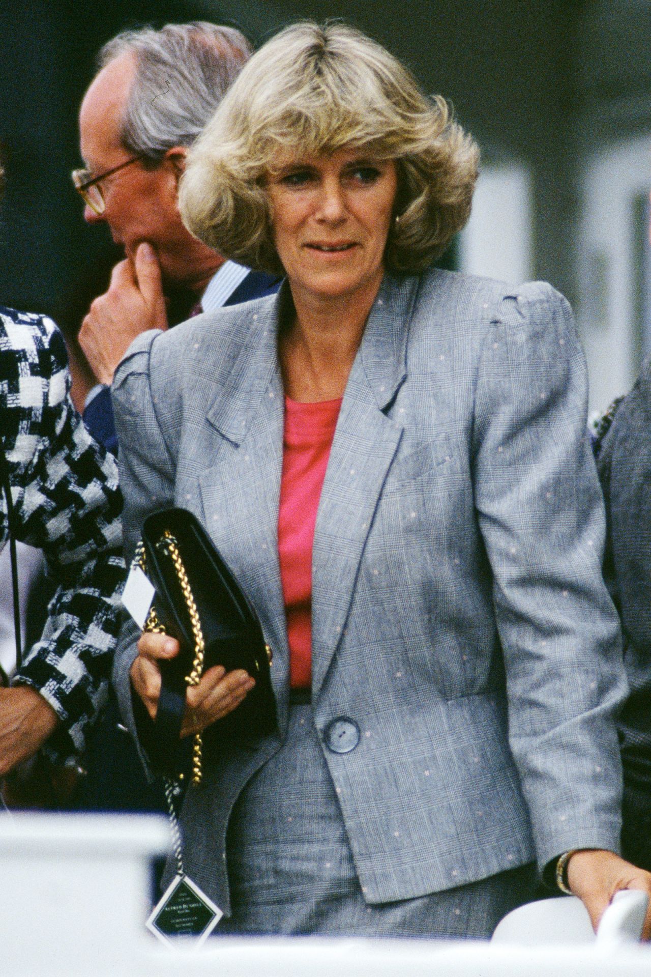 During the '80s and '90s, matching skirt suits — complete with powerful shoulder padding — were a mainstay in Camilla's wardrobe. In 1992, while attending a polo match at Smith's Lawn in Windsor, Camilla opted for a gray and fuchsia combination.