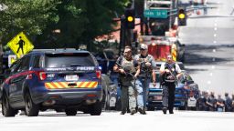 Law enforcement officers arrive near the scene of an active shooter on Wednesday, May 3, 2023 in Atlanta. Atlanta police said there had been no additional shots fired since the initial shooting unfolded inside a building in a commercial area with many office towers and high-rise apartments.   (AP Photo/Alex Slitz)