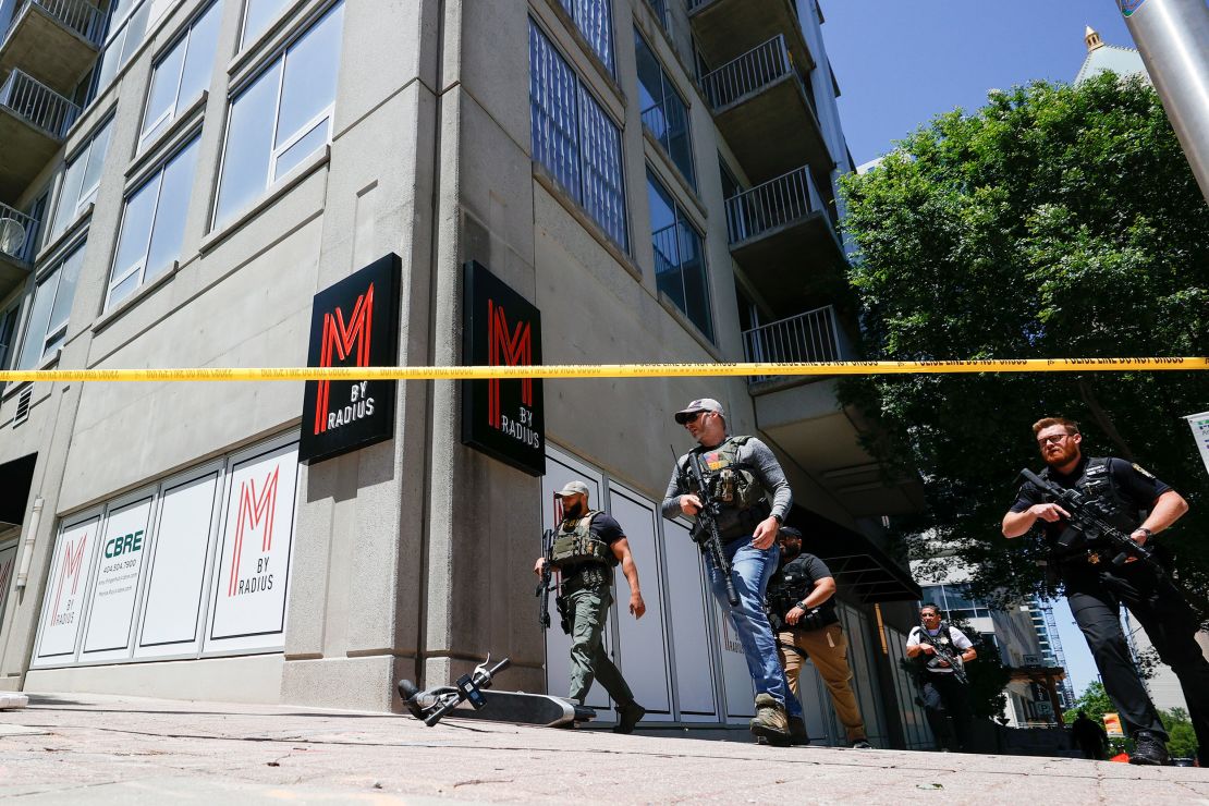 Law enforcement officers arrive near the scene of an active shooter on Wednesday, May 3, 2023, in Midtown Atlanta.
