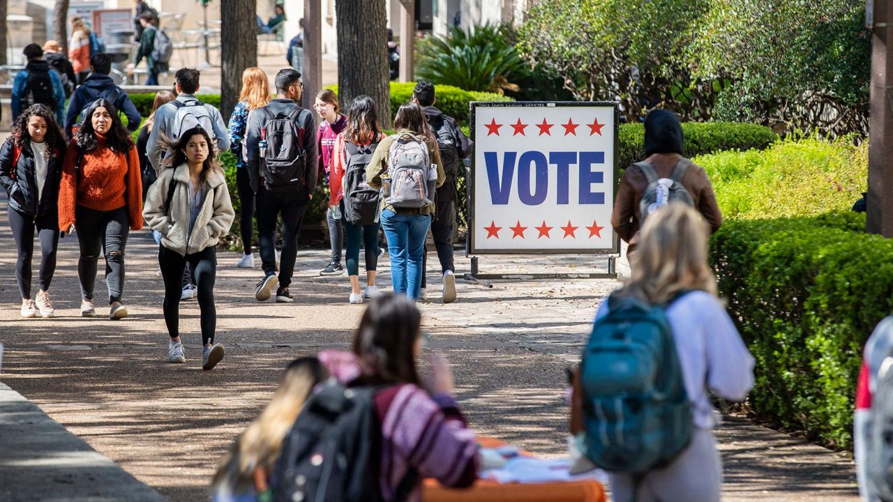 University of Texas Students walk an early voting site in on the campus of University of Texas, Tuesday, Feb. 18, 2020. Early primary voting for began Tuesday for Texas and Arkansas ahead of Super Tuesday 2020. [RICARDO B. BRAZZIELL/AMERICAN-STATESMAN]Rbb Early Voting