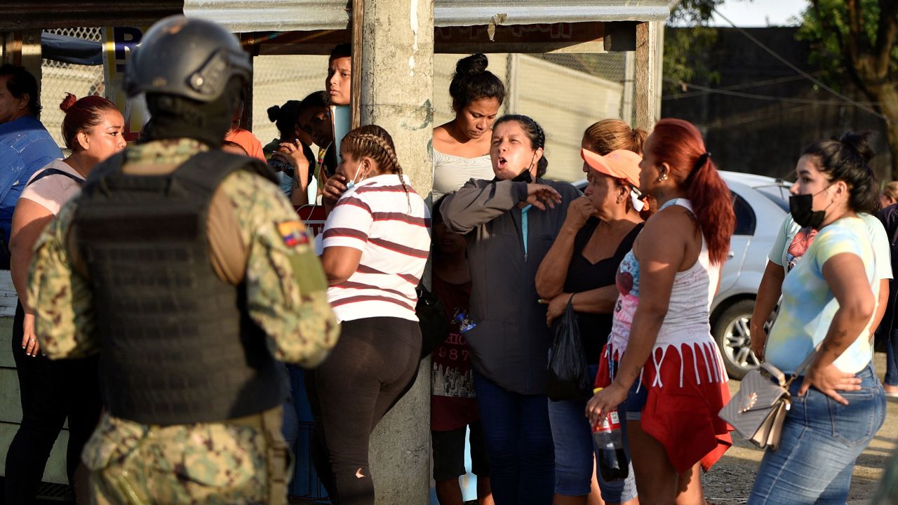 People gather outside the Penitenciaria del Litoral prison after a riot, in Guayaquil on April 14, 2023.