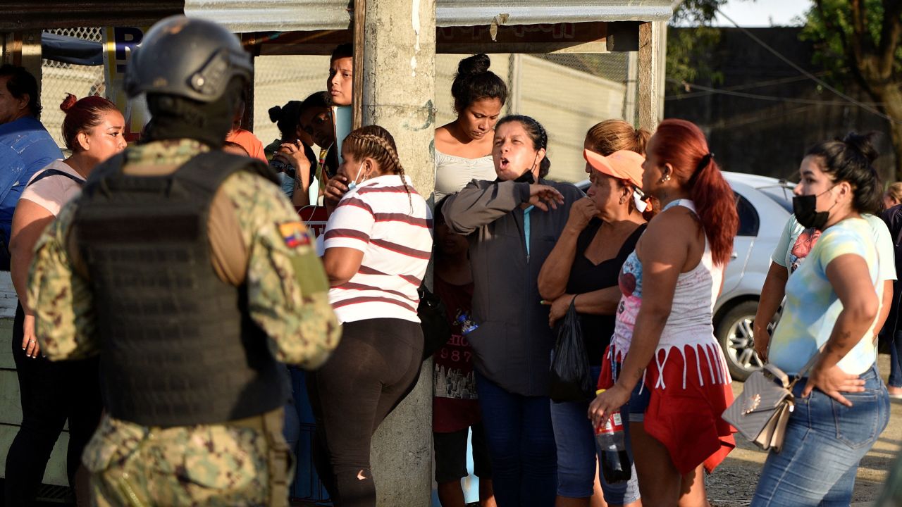 People gather outside the Penitenciaria del Litoral prison after a riot, in Guayaquil on April 14, 2023. 