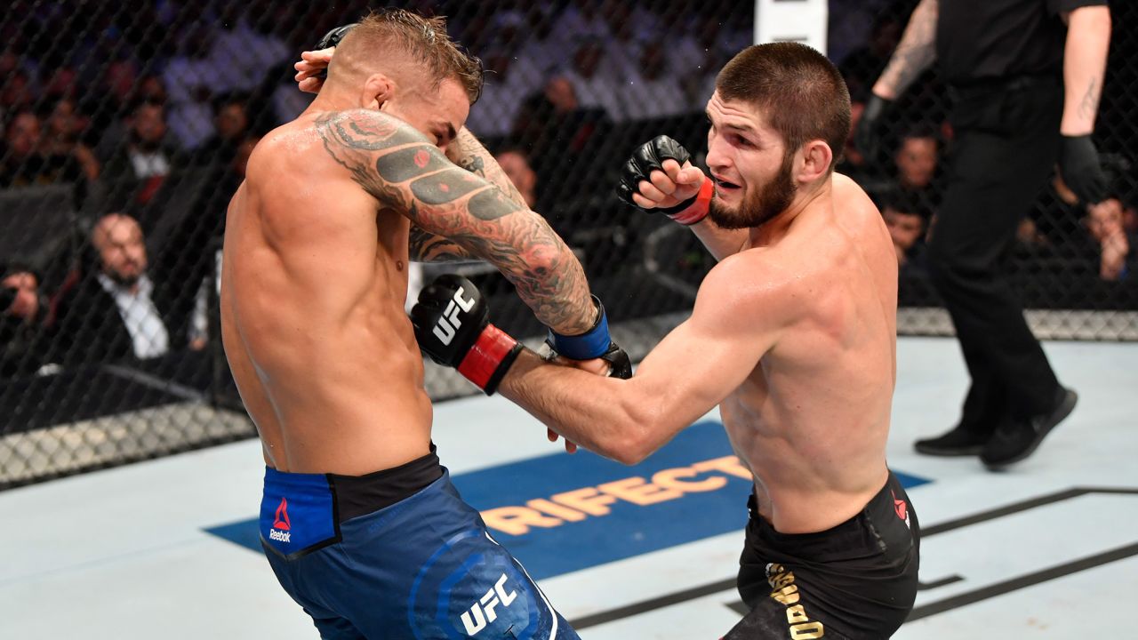 Nurmagomedov punches Dustin Poirier in their lightweight championship bout at UFC 242  on September 7, 2019.