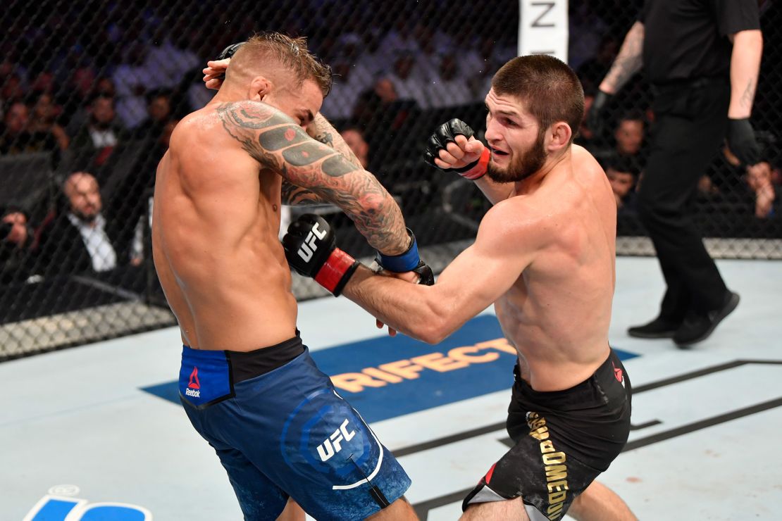 Nurmagomedov punches Dustin Poirier in their lightweight championship bout at UFC 242  on September 7, 2019.