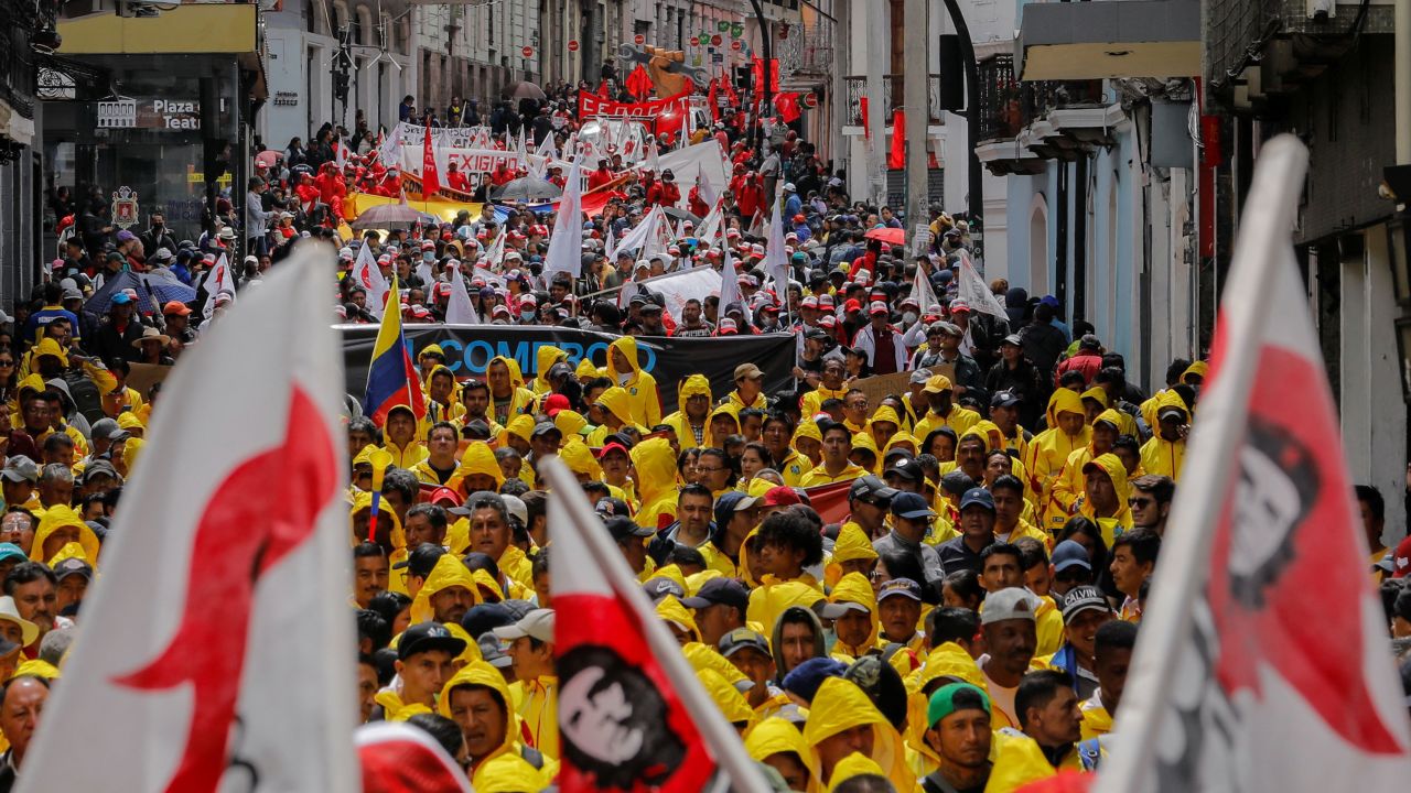 Members of unions and civil society groups march on International Workers' Day to demand that Ecuador's President Guillermo Lasso, who is facing an impeachment process, leave office on May 1, 2023. 