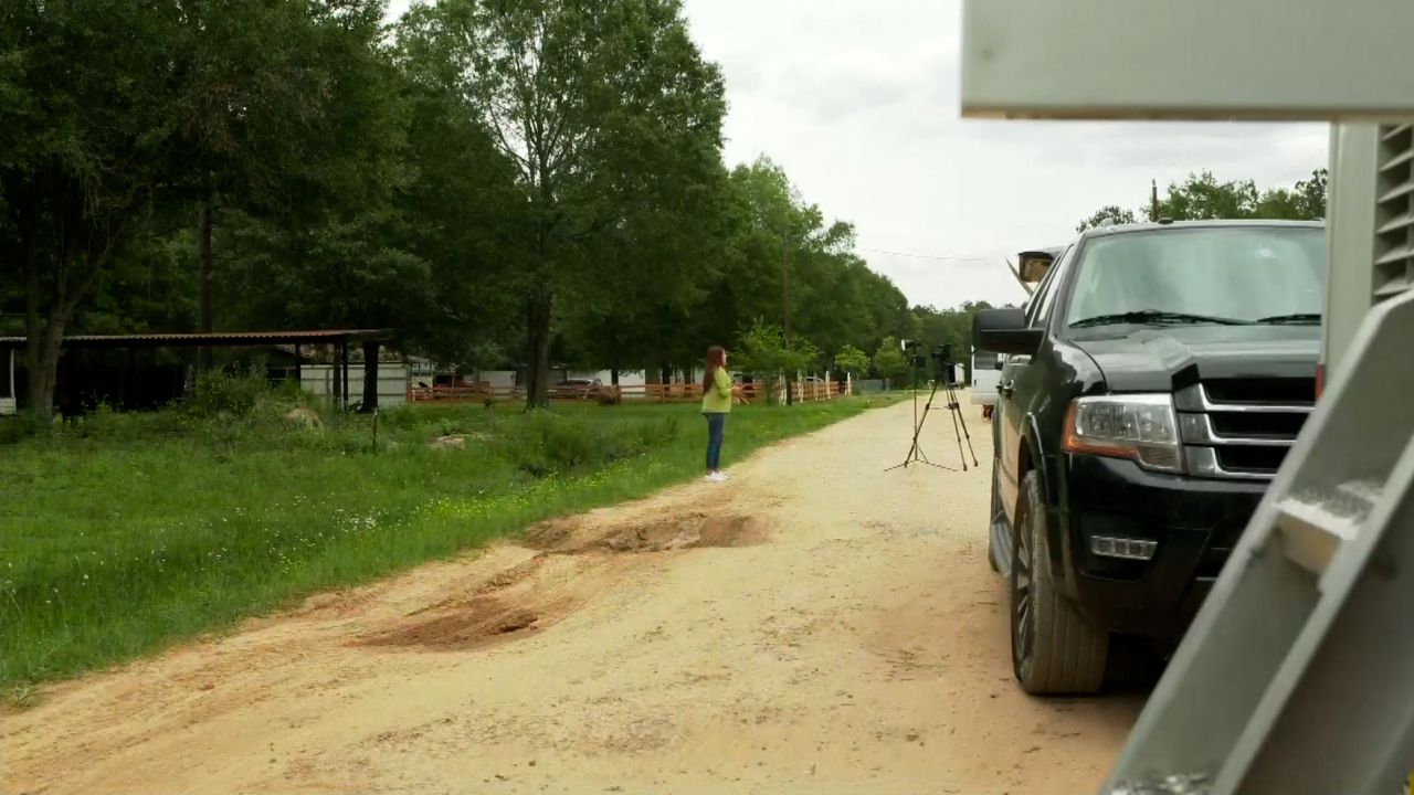 Potholes and large holes in dirt roads are common in Cleveland, Texas.