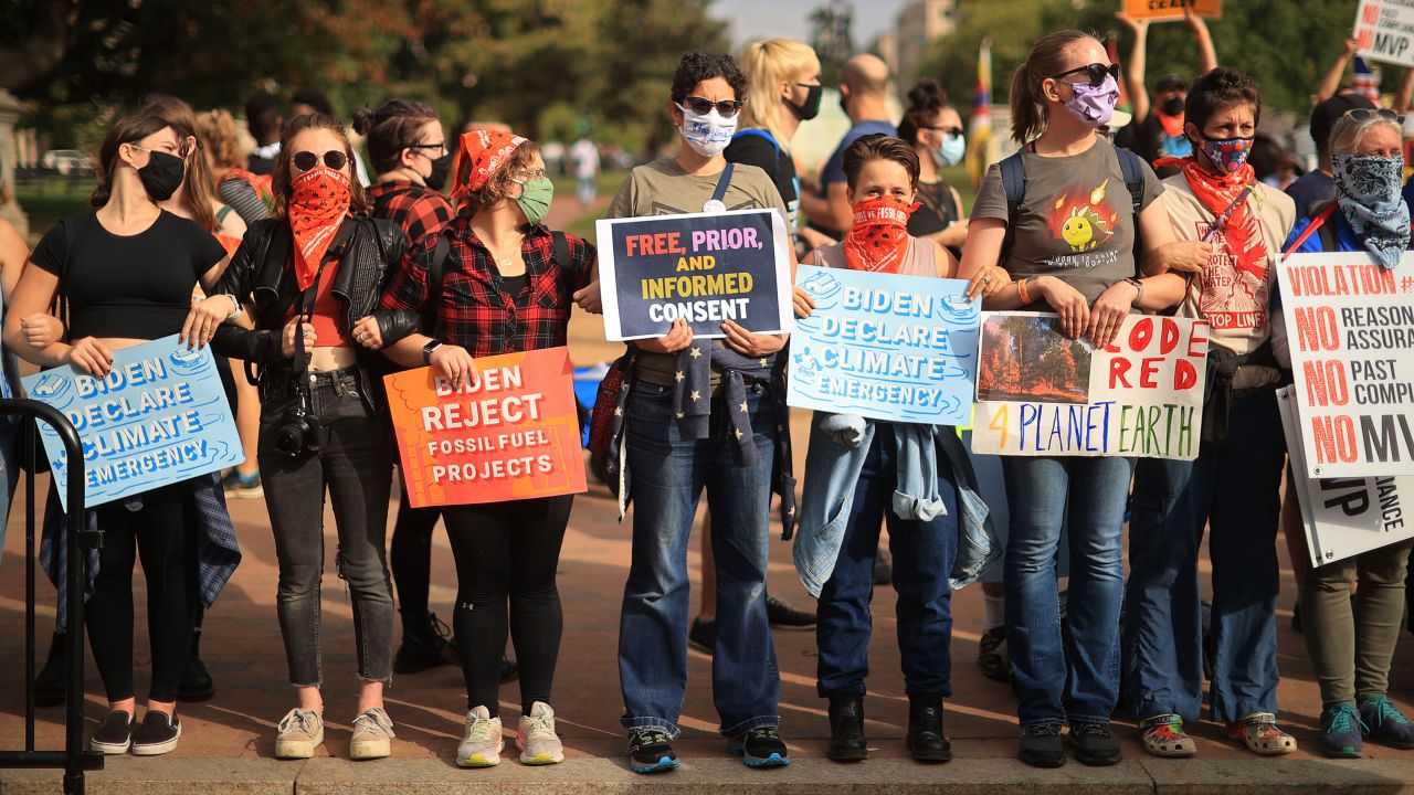 Demonstrators rally outside the White House as part of the 'Climate Chaos Is Happening Now' protest on October 13, 2021, in Washington, DC. 