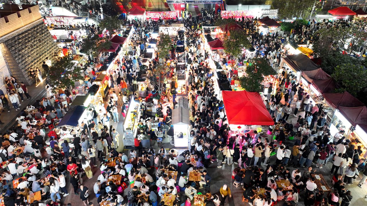 Tourists visit a night market in Liuzhou, a city in the Guangxi Zhuang Autonomous Region on April 29, 2023.