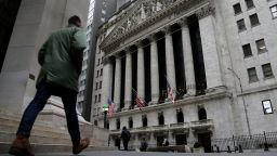FILE - People pass the front of the New York Stock Exchange in New York, on March 22, 2023. Brinkmanship in Washington over raising the U.S. debt ceiling has begun to raise worries in parts of the financial markets. (AP Photo/Peter Morgan, File)