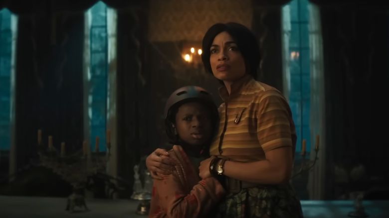 Chase W. Dillon and Rosario Dawson in Disney's "Haunted Mansion."