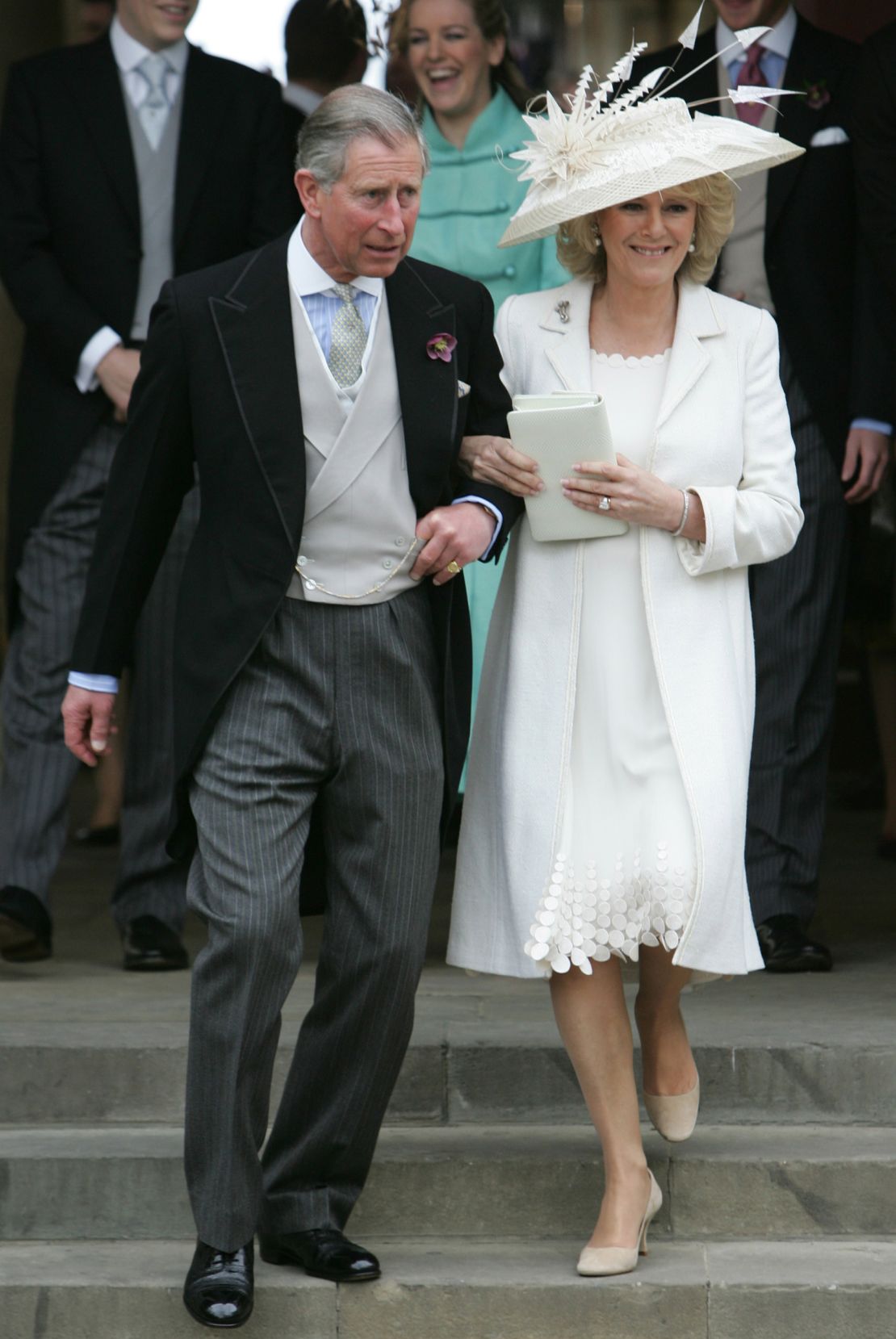 At her wedding to Charles in 2005, Camilla wore two outfits. The first was a white silk coat and chiffon dress by Robinson Valentine finished with a feather and lace trimmed hat by Philip Treacy.